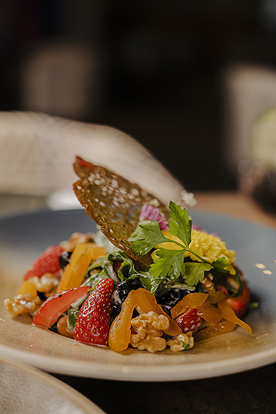 Fruit, beetroot, and arugula salad